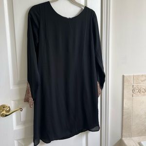 Black dress with rose gold on sleeves